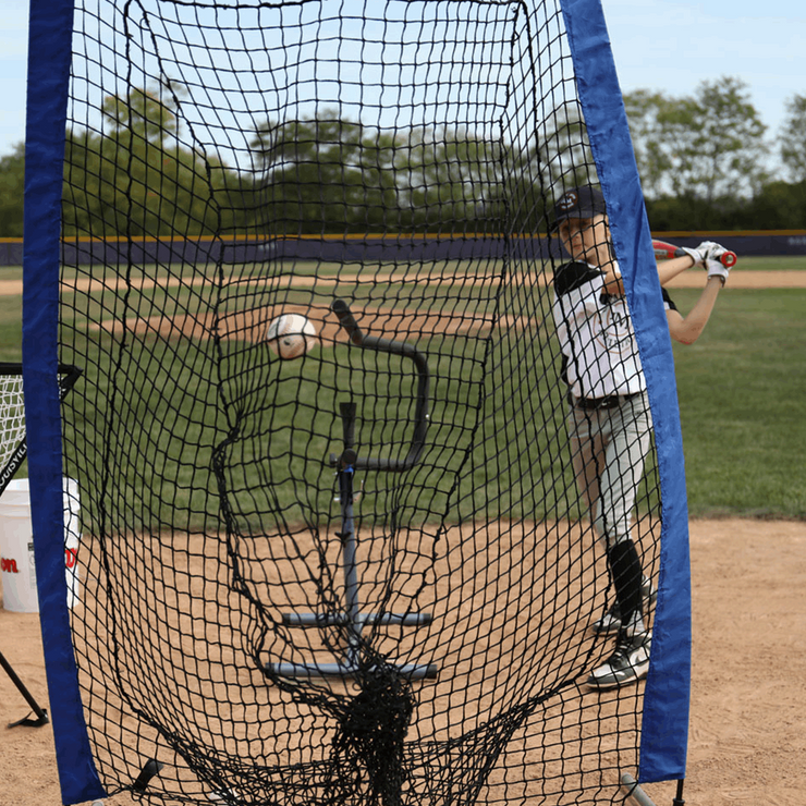 Baseball swing trainer bundle with a player practicing hitting in a baseball field setting