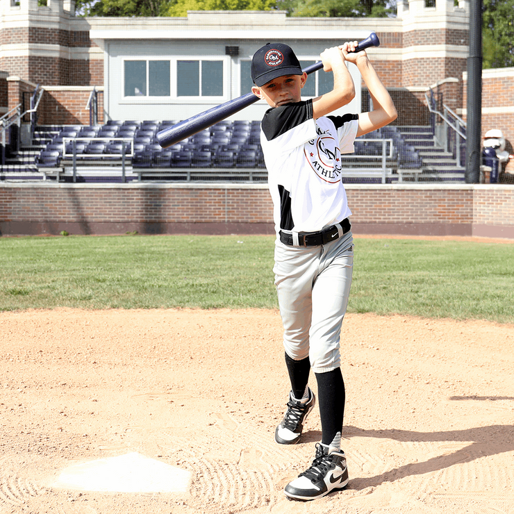 Young player using the Louisville Slugger C271 plastic bat and ball combo at a baseball field