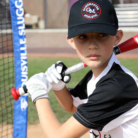 Young athlete using Louisville Slugger Power Grip during batting practice for improved performance