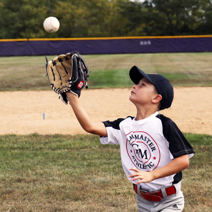 Child practicing catching with Swax training baseball for improved baseball skills