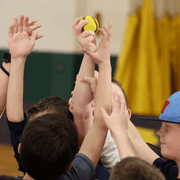 Kids participating in Baseball5, reaching for the USA Baseball Baseball5 Ball during a practice session