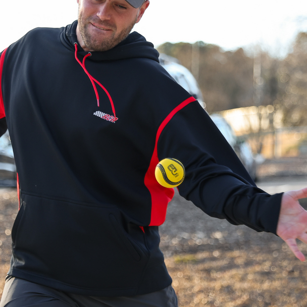 Player throwing a GameMaster Athletic USA Baseball Baseball5 Ball during practice outdoors