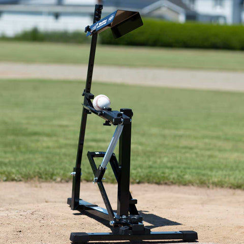 Louisville Slugger Black Flame pitching machine on a baseball field for practice and training.