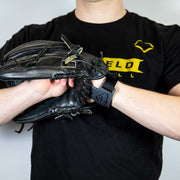 Person demonstrating Louisville Slugger Glove Shield wrist protection with a baseball glove for safety during training