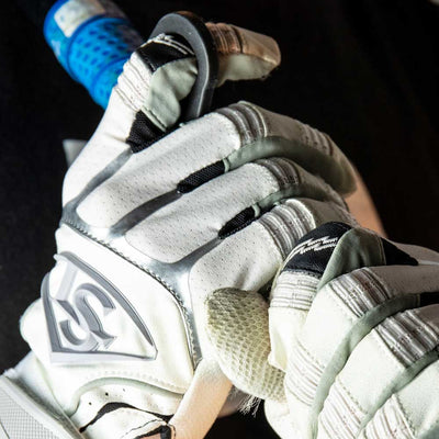 Close-up of a hand gripping a bat with Louisville Slugger Power Grip for improved control and comfort