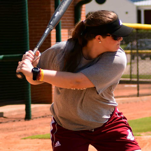 Athlete practicing baseball swing with Louisville Slugger Power Grip bat for improved performance