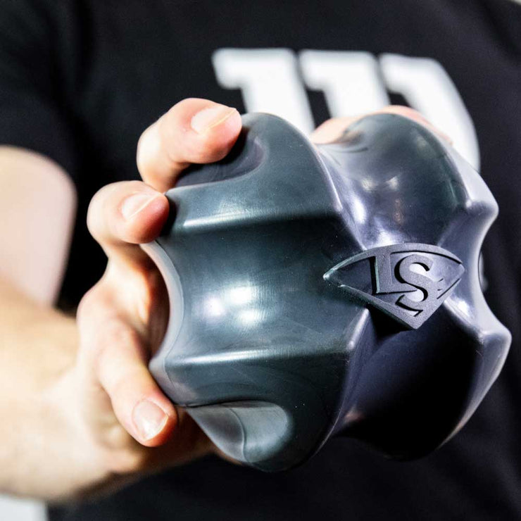 Louisville Slugger XBALL grip strength & recovery trainer being held in hand for strength training