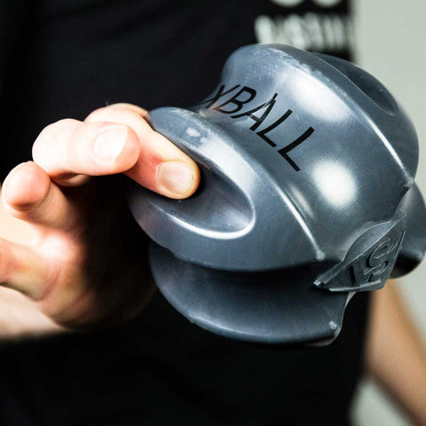 Person using Louisville Slugger XBALL grip strength & recovery trainer for hand exercises